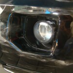 Before and after photographs of a damaged, black, Range Rover that was repaired by Elite Paint & Body Shop in West Palm Beach, FL.
